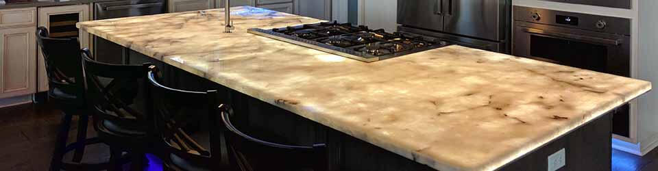 LED backlighting for kitchen counters and other translucent surfaces